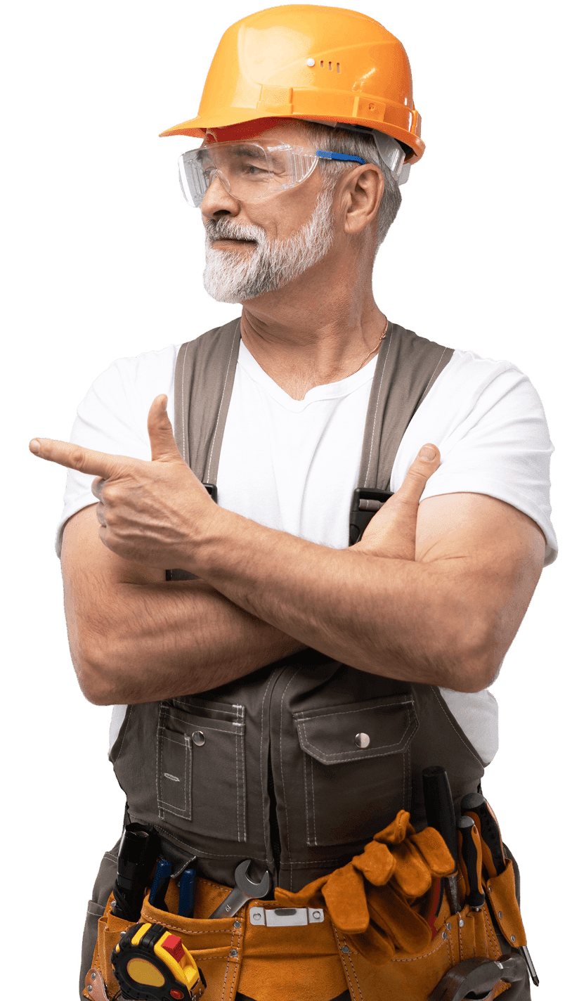 An older man with a gray beard pointing to the left with his right hand, while his left arm is crossed over his chest.