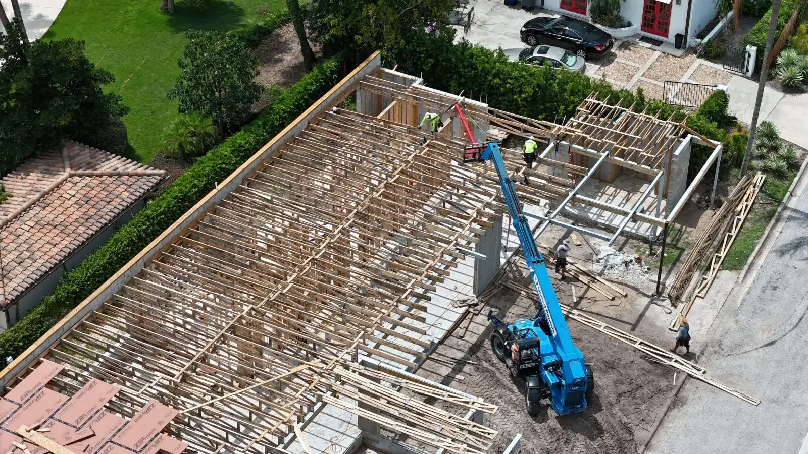 Construction site with building framework and crane.